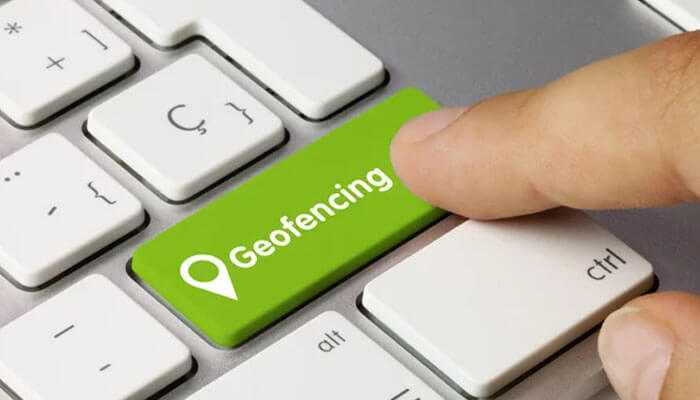 Geofencing marketing strategy - tycoonstory | tycoonstory media Geofencing marketing strategy is represented when a finger presses a location icon on a keyboard-key labeled'Geofencing'.