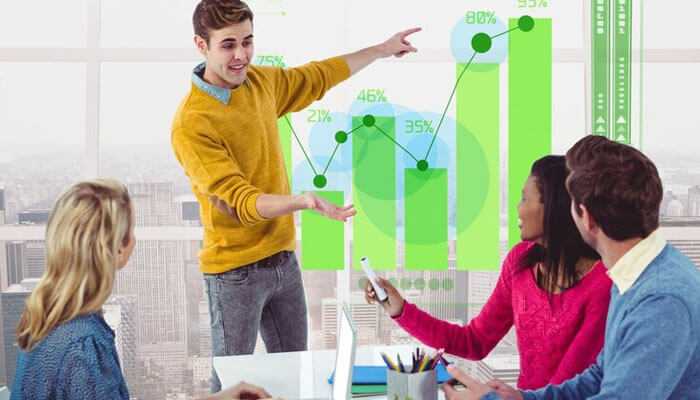 Potential for growth and scalability - tycoonstory | tycoonstory media A group of colleagues discussing a growth chart, symbolizing the potential for increased earnings through loan referral programs for affiliate marketers