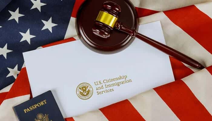 Provide sufficient supporting evidence - tycoonstory | tycoonstory media Gavel, uscis envelope, and passport on an american flag background, representing uscis requirements.