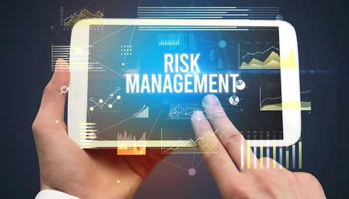 Risk management - tycoonstory | tycoonstory media A person displaying risk management with data charts and graphs with a blue background, it represents strategies for managing risk in bitcoin trading.