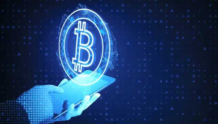 Technological advancements and upgrades - tycoonstory | tycoonstory media A smartphone with the digital symbol of bitcoin an art image showing technology advances in bitcoin value fluctuations