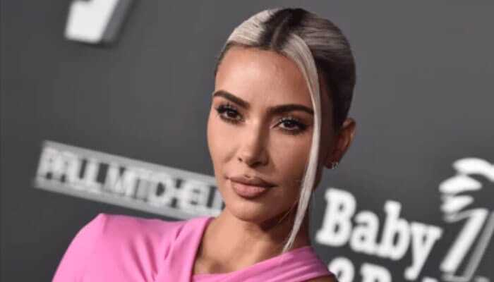 The impact of social media on kims wealth - tycoonstory | tycoonstory media Kim kardashian net worth: kim kardashian at a red carpet event in a pink dress, showcasing her glamorous style and influence