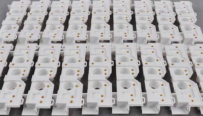 Tool wear and cutting forces - tycoonstory | tycoonstory media The rows of white plastic prototype parts with circular holes and embedded gold-colored metal inserts signal the ideal material for rapid prototyping.
