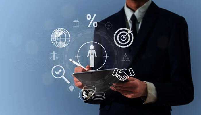 Addressing broad business questions with ease - tycoonstory | tycoonstory media A businessperson holding a tablet showing icons of strategic research and insights, target audience, and financial growth.