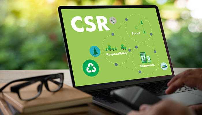 Environmental considerations and corporate social responsibility - tycoonstory | tycoonstory media Csr and workplace happiness concept on a laptop, highlighting corporate, social, and environmental responsibility for employee well-being