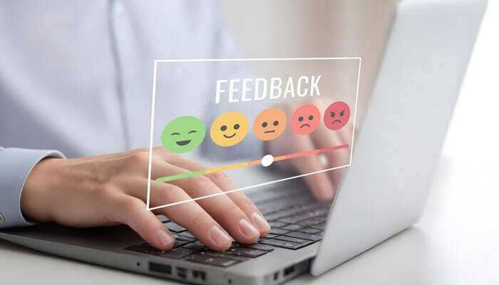 Gathering user feedback - tycoonstory | tycoonstory media A person typing on a keyboard with colorful emojis displaying different expressions appearing above represents android automation testing.