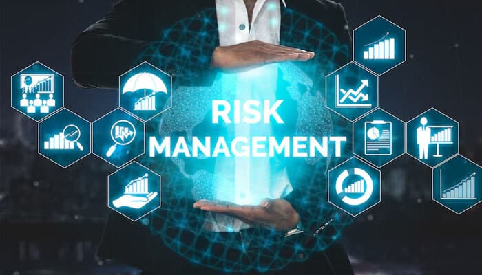 Ignoring risk management rules - tycoonstory | tycoonstory media Forex prop firms risk management concept with a businessman protecting a glowing globe surrounded by digital icons representing financial growth, charts, and data analysis