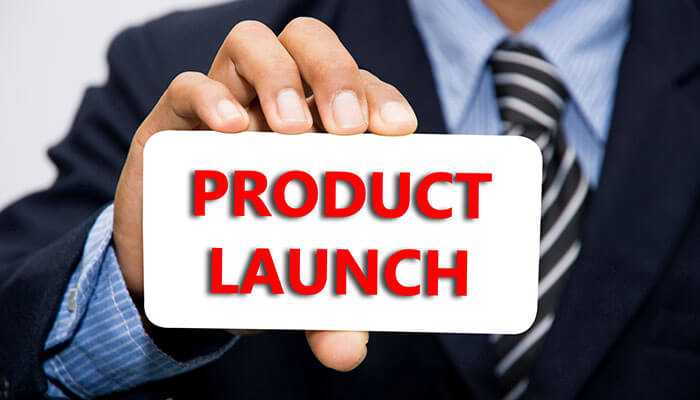 Launch product on time - tycoonstory | tycoonstory media Businessperson holding a white card with bold red text product launch symbolizing the introduction of new app development services to the market