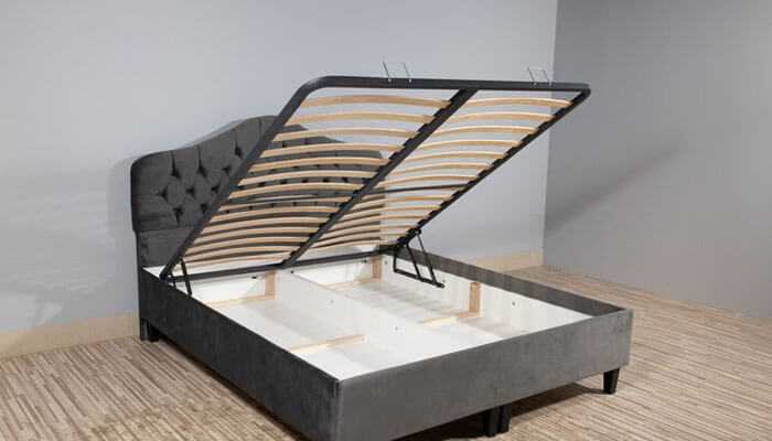 Prioritizing functionality and design - tycoonstory | tycoonstory media Platform bed with open storage compartment and upholstered headboard, contrasting with styles like canopy and sleigh beds.