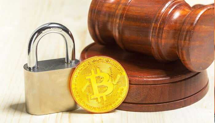 Regulatory environment - tycoonstory | tycoonstory media A gold bitcoin coin next to a padlock and a judge's gavel: a symbol of cryptocurrency regulations and security.