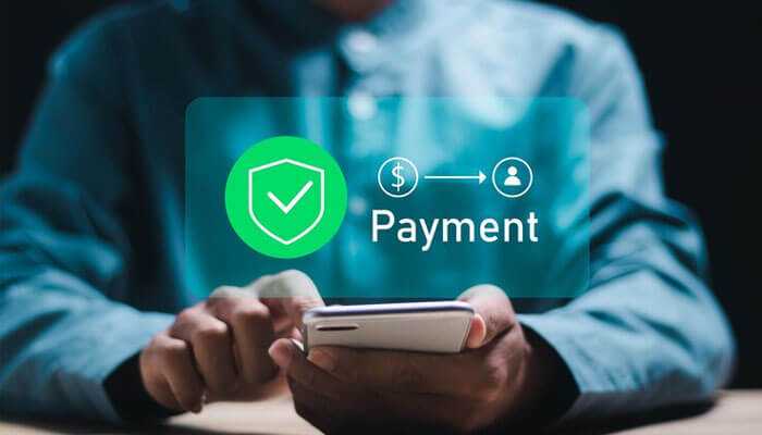 Secure payment methods - tycoonstory | tycoonstory media Person holding a smartphone with a secure payment icon displayed, symbolizing safe and protected transactions for mcw casino account secure