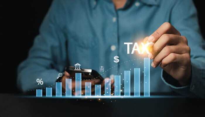 Tax-deferred growth benefits - tycoonstory | tycoonstory media Person managing finances on mobile device with focus on variable life annuities, tax planning, investment growth, and digital wealth management strategies