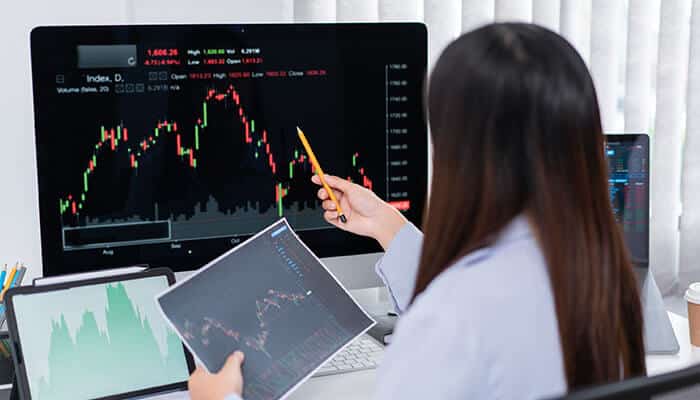 Technical indicators and their interpretations - tycoonstory | tycoonstory media Women checking the technical indicators and their interpretations in stock chart
