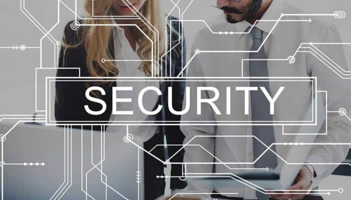 Think about your venture security - tycoonstory | tycoonstory media Two people are analyzing small business it support with a'Security' overlay, indicating robust data protection.