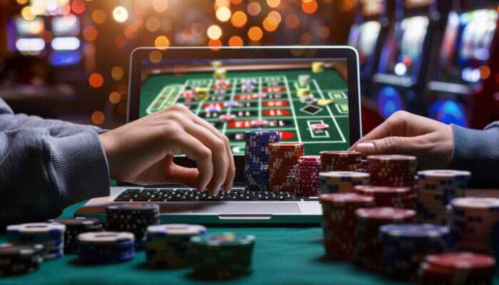 Tips for safe and enjoyable play - tycoonstory | tycoonstory media The image shows a laptop displaying a roulette game, surrounded by poker chips, creating an immersive online casinos vibe. It captures the excitement of digital gaming from home.