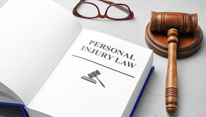 Where probate and personal injury law intersect - tycoonstory | tycoonstory media Open book titled personal injury law with a gavel and eyeglasses, symbolizing the connection between probate law and personal injury claims