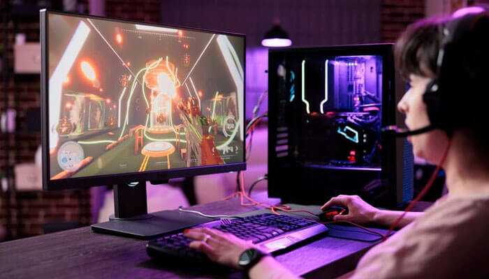 Why choose tiranga colour trading - tycoonstory | tycoonstory media Person gaming on a desktop with colorful screen, headset, and purple lighting, symbolizing tiranga colour trading