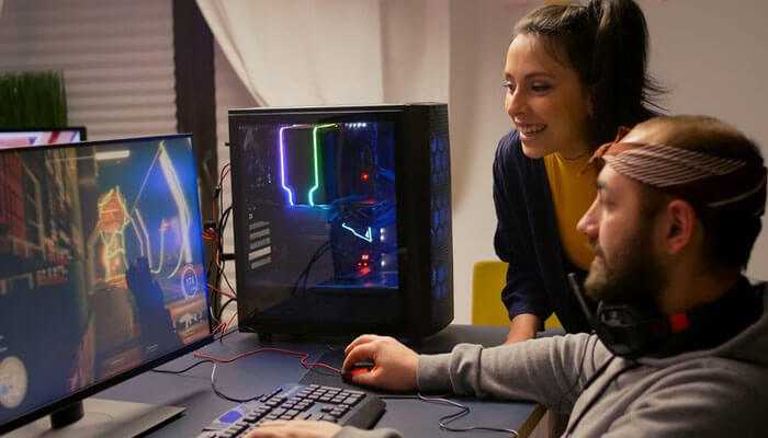 Benefits of apks for developers - tycoonstory | tycoonstory media Two gamers playing a multiplayer game on a high-performance gaming pc, highlighting the impact of apks in the mobile gaming industry for enhanced and customized gaming experiences