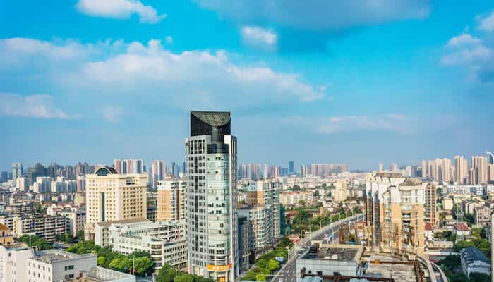 Borivali a bustling suburb offering urban convenience - tycoonstory | tycoonstory media A busy cityscape with skyscrapers, a clear blue sky, and an urban hub of activities-a city with 2 bhk flats in mumbai.