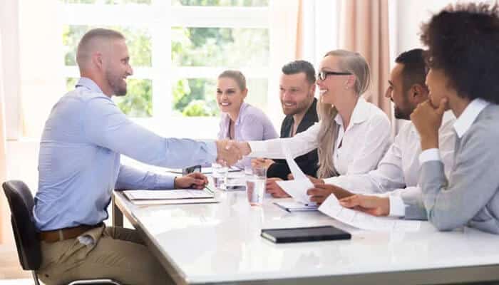 Choosing the best staffing agency in dubai - tycoonstory | tycoonstory media Staffing companies in dubai organizing a recruitment meeting where candidates engage with the hiring team, showcasing a collaborative hiring process