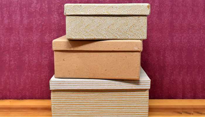 Emotional connection - tycoonstory | tycoonstory media A stack of eco-friendly sports accessories packaging boxes in textured design forms, showcasing sustainable and stylish packaging solutions.