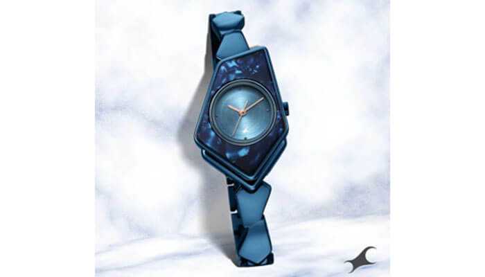 Eye-catching statement watches that steal the scene - tycoonstory | tycoonstory media A fashionably different, futuristic statement watch with a triangular-shaped blue face and a stylishly patterned strap that is sure to draw attention.