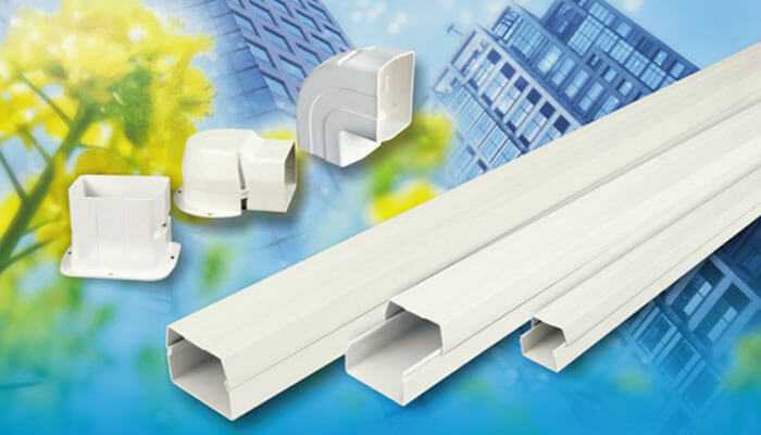 Key characteristics of pvc pipes - tycoonstory | tycoonstory media Accessories for pvc cable ducts and wiring solution covers against the background of a modern building with greenery.