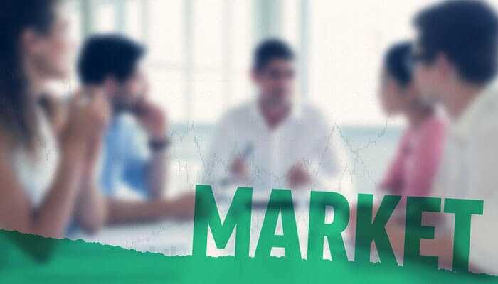 Market your business effectively - tycoonstory | tycoonstory media A team of professionals discussing market strategies, focusing on building a thriving business, with the word market overlayed.