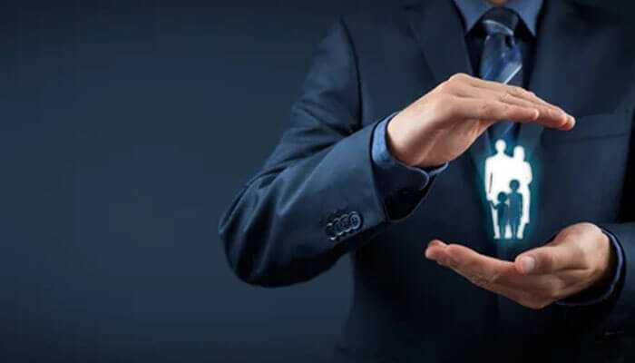 Protection for your familys future - tycoonstory | tycoonstory media A professional shielding a holographic family: this means integrating term life and health insurance for full protection.