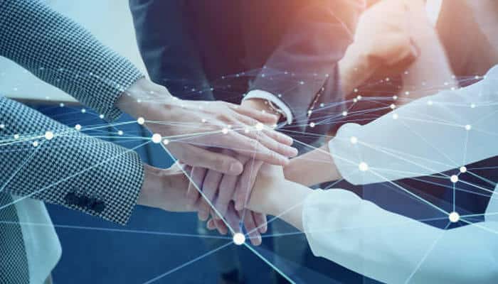 Support and community - tycoonstory | tycoonstory media Hands put together for teamwork and collaboration, and the nodes connected are all about professional growth.