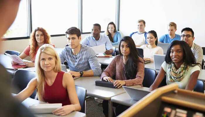 Tips to maximize your gmat classes - tycoonstory | tycoonstory media Students in a classroom setting, intently listening, representing interactive learning in gmat classes, mumbai.