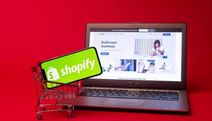 Why its important - tycoonstory | tycoonstory media Shopify dropshipping store logo on the phone in a shopping cart, with a laptop in the background showing shopify's website.