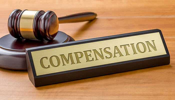 Breaking down compensation factors - tycoonstory | tycoonstory media Portland car accident lawyer : the image shows a gavel and a "compensation" sign, representing a