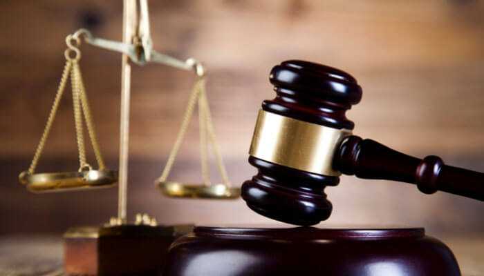 Defending your rights under the constitution - tycoonstory | tycoonstory media Criminal defense attorney: wooden gavel placed in front of the scales of justice, symbolizing law, legal proceedings, and the role of the attorney in ensuring justice and fairness.