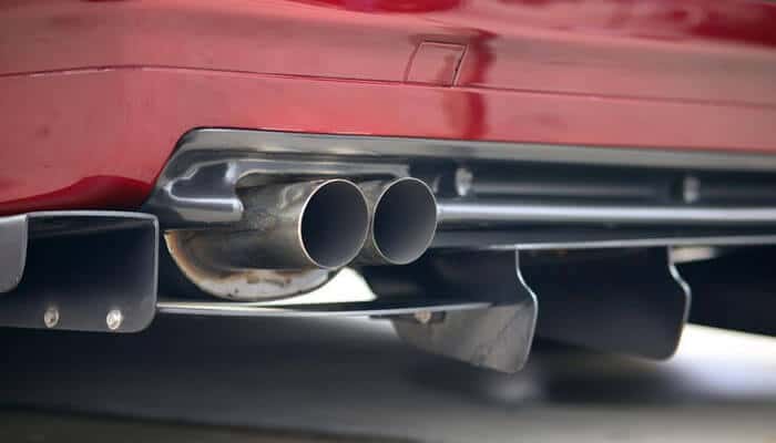 Durability you can depend on - tycoonstory | tycoonstory media Aftermarket f150 exhaust system showing a close-up of dual exhaust pipes and a rear diffuser with a performance-oriented design