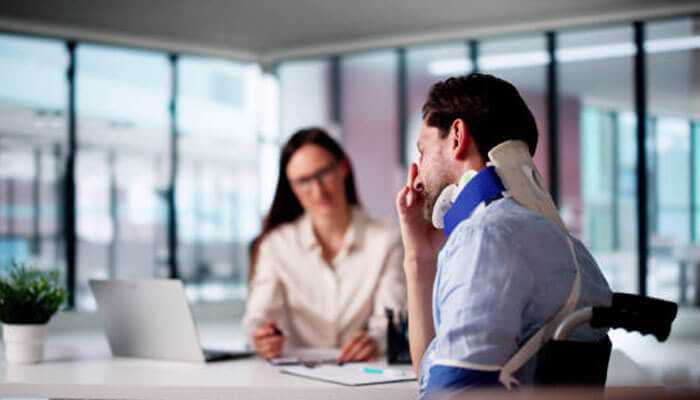 Evidence of financial losses - tycoonstory | tycoonstory media Injured man wearing a neck brace consulting with a professional woman in an office setting, discussing details of a florida personal injury case