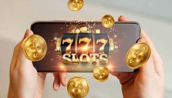 Know when to stop - tycoonstory | tycoonstory media A person holding a smartphone displaying a 777 slots game with golden coins, depicting online slots for real money.