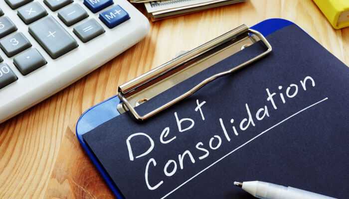 Personal loan for debt relief - tycoonstory | tycoonstory media This is an image of high-interest debt and financial planning through debt consolidation.