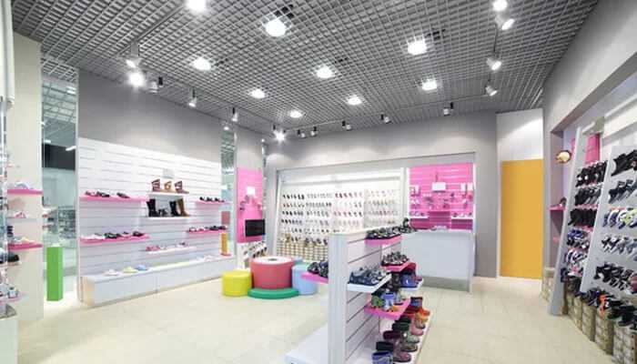 Setting up for smart lighting success - tycoonstory | tycoonstory media Smart lighting design in retail shoe stores provides bright and energy-efficient lighting with organized product displays.