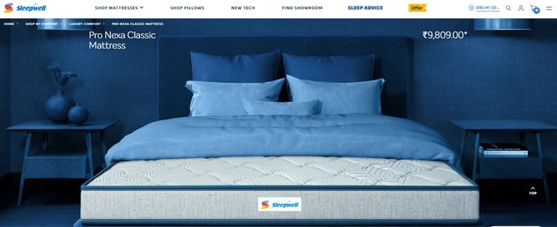 Sleepwell pro nexa classic mattress - tycoonstory | tycoonstory media Ad for sleepwell's Pro Nexa Classic Mattress priced at ₹9,809, set in a blue-themed bedroom