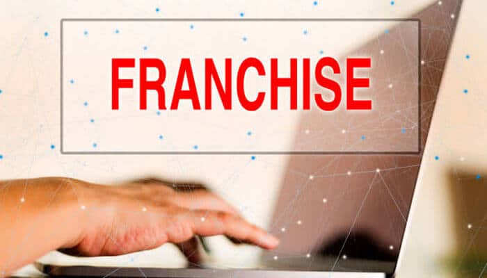 Streamlining franchises and licenses - tycoonstory | tycoonstory media Franchise concept with a person typing on a laptop, highlighting in bold red text the words franchise and trademark registration.