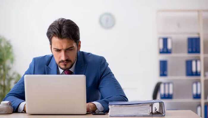 Use cte programs and online resources - tycoonstory | tycoonstory media Businessman working on a laptop, focusing on data analysis and technical skill development for startup growth and success.