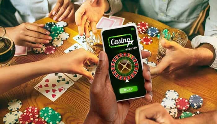 Why choose live casino star - tycoonstory | tycoonstory media Group playing poker with cards and chips, while one person uses a smartphone displaying the live casino starexch game.