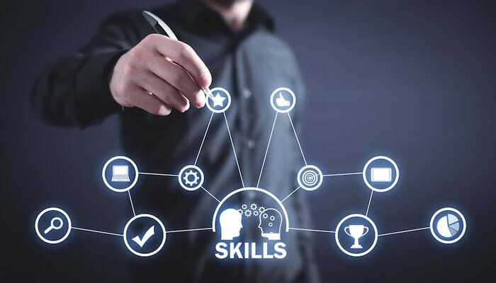 Build a range of skills - tycoonstory | tycoonstory media A businessman interacting with a digital interface on career paths in expanding industries