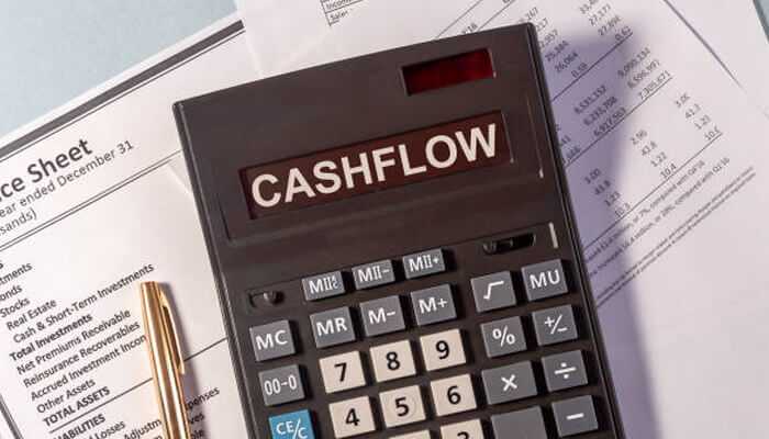 Cash flow issues are becoming a problem - tycoonstory 1 | tycoonstory media Hire an accountant – calculator displaying'CASHFLOW' on financial documents, emphasizing the importance of professional accounting for business success.
