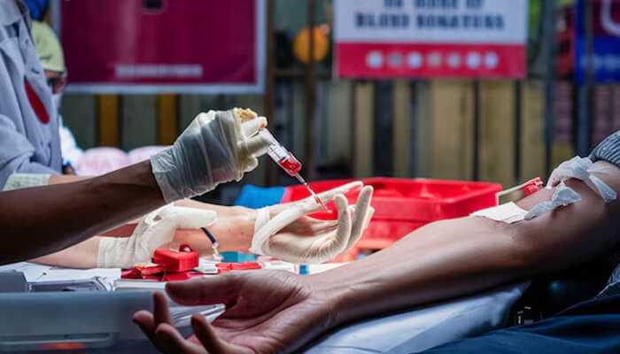 Ensuring compliance with regulations - tycoonstory | tycoonstory media Bloodborne pathogens training - healthcare worker drawing blood for testing in a safe and controlled environment.