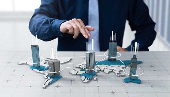 Key amenities to look for in upcoming projects in chennai - tycoonstory | tycoonstory media A business professional interacts with a 3d model, symbolizing upcoming projects in chennai and real estate investment opportunities