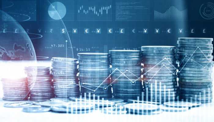 Understanding economic influences - tycoonstory | tycoonstory media Stacks of coins with digital charts and global economic data overlays, illustrating fundamental factors used in currency market analysis to evaluate economic influences.