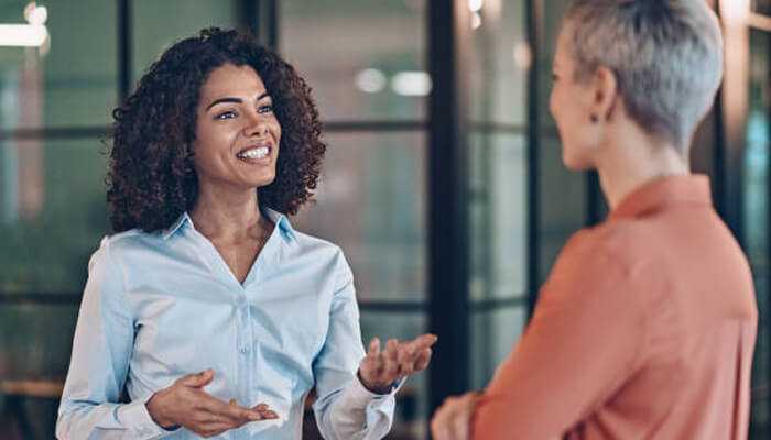 What does wyf mean in a text and how to use the acronym in conversations - tycoonstory 1 | tycoonstory media Wyf mean in text illustrated by two professionals having a conversation, representing the use and understanding of wyf meaning in everyday text and communication.