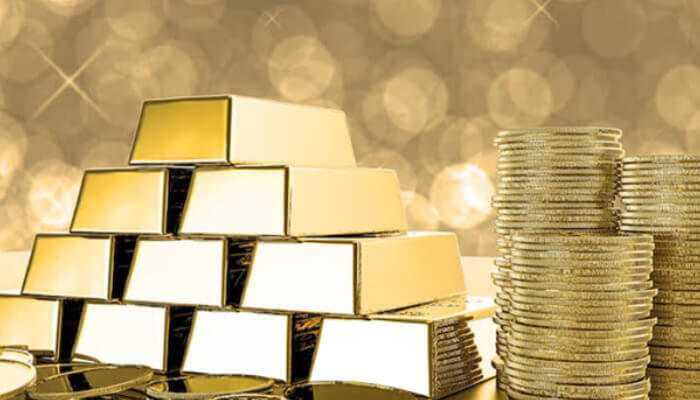 Benefits of investing in gold - tycoonstory | tycoonstory media Stacks of gold bars and coins symbolizing wealth and investment security, representing the role of a gold ira custodian in protecting retirement assets.